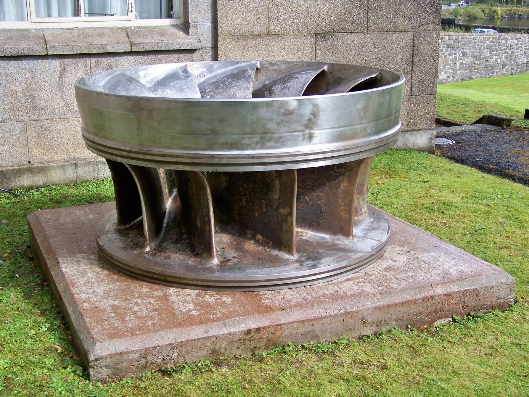 A Francis turbine runner displayed outside a power station